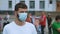 Masked protester activist under covid-19 lockdown. Coronavirus restriction rally