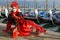 Masked woman with red headdress