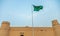 Masmak Fortress with Saudi Arabia flag waiving on the wind , Al Riyadh, Saudi Arabia