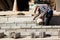 Mason or Brick builders are building cement brick wall in construction site. Workers are building buildings or buildings for