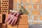 Mason bricklaying background with trowel and clay brick blocks