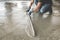 Mason building a screed coat cement