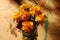Mason Jar of Yellow Marigolds on painted rustic Art Table