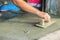 Mason worker use trowel to smooth or leveling liquid concrete of