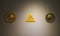 Masonic symbols on white wall in museum