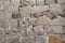 Masonry castle wall stone grunge texture. Grungy vintage fortress granite and sandstone. Masonry house rough old stone or rock of