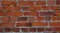 Masonry of orange rectangular red brick
