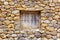 Masonry stone wall with grunge wood window