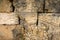 Masonry wall of old stone blocks of limestone. texture