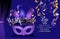 Masquerade ball party purple invitation banner with masquerade deco object.