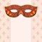 Masquerade mask on a rose background