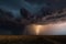 mass of storm clouds with lightning and thunderstorms in the distance