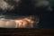 mass of storm clouds with lightning and thunderstorms in the distance