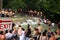 Mass Tourism - Crowds of tourists climbing up the cascades of a