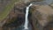 Mass of white water falling to deep canyon, crashing on stones and spraying. Breath taking Nordic natural scenery