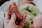 Massage of baby`s feet. Mother`s hand touching tiny newborn baby feet.