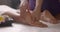 Massage in beauty salon. Closeup of feet massage. Spa client receiving great thai massage. Healthcare concept. Slow