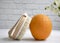 Massage brush, orange fruit, flower  concept on a light background