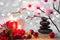 Massage composition christmas spa with candles, orchids and black stones