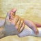 Massage of the female foot, hands of the masseur of the man