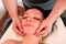 Massage of the head and face in spa center