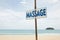 Massage sign on tropic beach background