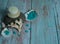 Massage stones, large sea salt crystals, candle, shells and corals on a light blue wooden background.