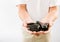 Massage therapist holding warm stones