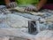 Massaged dough mixed with black sesame seeds on a table being prepared and getting ready to be deep fried to make Chinese bread or