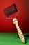 Massager with red drum, tree handle and metal needles on red background. is groundless. subject photo