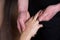 Massagist scrubbing woman hand and fingers natural scrub in spa salon, closeup.