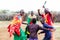 Massai family celebrating and dancing