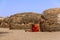 A Massai woman in front of the traditional huts, Tanzania