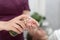 Masseur applies the oil to the hands to perform the massage. Cosmetologist treats the hands before the procedure. Close up