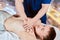 Masseur doing deep tissue chest massage for men.