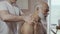 Masseur makes a therapeutic massage to senior man