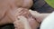 Masseur is performing facial massage for middle aged woman, detail view, relaxing and enjoying