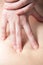 Masseur\'s hands doing deep tissue massage