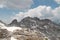 Massif of mountain covered by clouds and snow