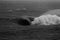 Massive Barrel Wave Breaking on Shallow Reef Black and White