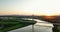 The massive cable-stayed bridge over the Suir River against the sunset 4k