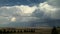 Massive clouds over farmland