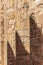 Massive columns after reconstruction inside beautiful Egyptian temple in Luxor with hieroglyphics, and ancient symbols. Karnak