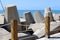 Massive concrete blocks and large stones are laid in a breakwater on the shores of the Mediterranean Sea