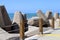 Massive concrete blocks and large stones are laid in a breakwater on the shores of the Mediterranean Sea