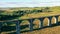 Massive desolated bridge with a woman on it filmed from above