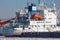 Massive different ship vessels trapped in ice tries to break and leave the bay between the glaciers, icebreaker and carrier vessel