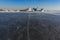 Massive different ship vessels trapped in ice tries to break and leave the bay between the glaciers, icebreaker and carrier vessel