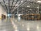 Massive Empty Industrial Warehouse Interior With Stacked Pallets