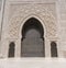 the massive entrance doors of the hassan ii mosque in casablanca